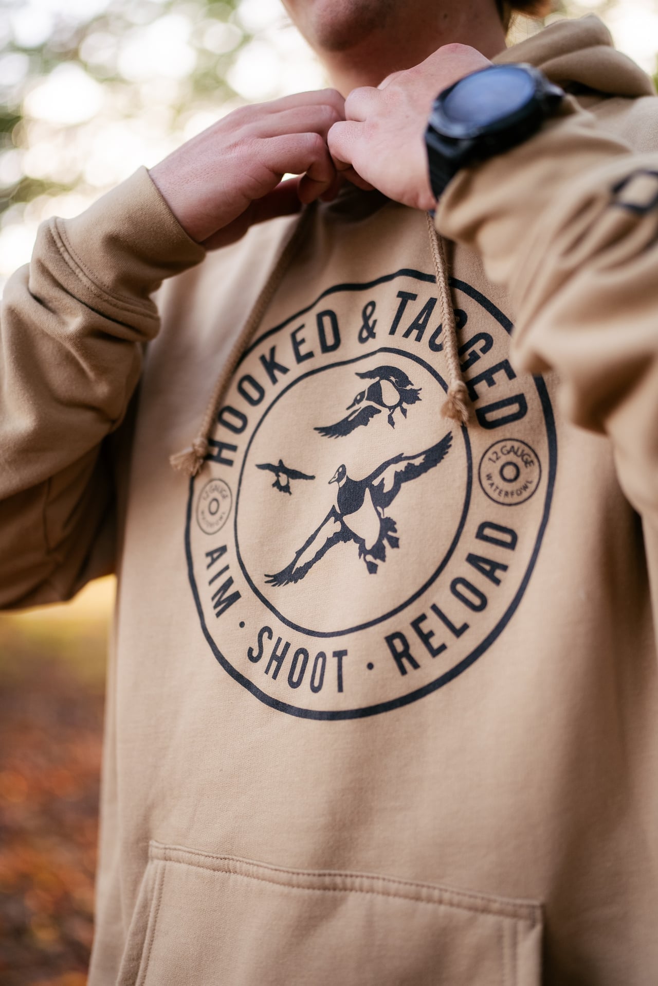 Aim. Shoot. Reload. Hoodie Hooked & Tagged, Inc.